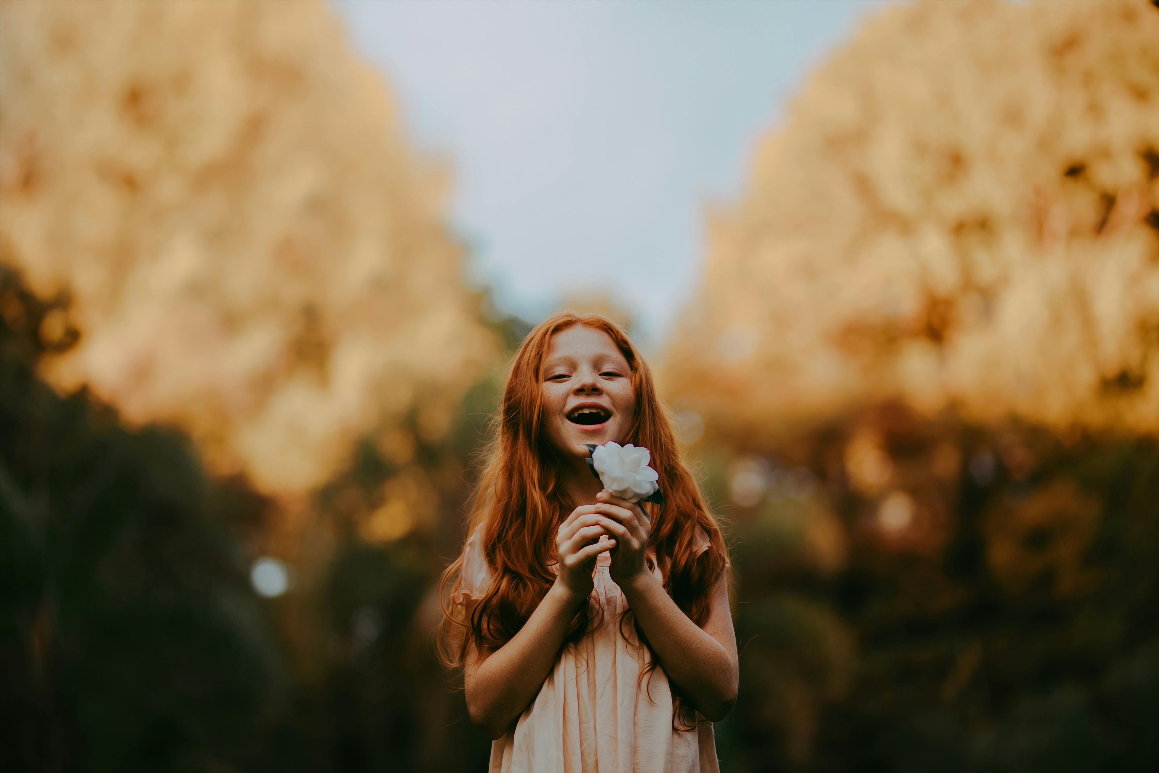 Girl holding flower in her hands